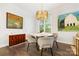 Bright dining area with round table, four chairs, and hardwood floors at 416 Queens Rd # 11, Charlotte, NC 28207