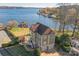 Beautiful lakefront home with a spacious yard and private dock at 49412 Wood Land Dr, Norwood, NC 28128