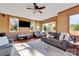 Spacious basement with comfortable seating, large windows, and hardwood floors at 49412 Wood Land Dr, Norwood, NC 28128