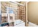 Bathroom with a shower/tub combo and diamond-patterned tile at 49412 Wood Land Dr, Norwood, NC 28128