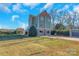 Three-story home with lake view, large yard, and detached garage at 49412 Wood Land Dr, Norwood, NC 28128
