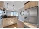 Bright kitchen with stainless steel appliances and a breakfast bar at 49412 Wood Land Dr, Norwood, NC 28128