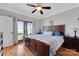Main bedroom with king bed and access to a private balcony at 49412 Wood Land Dr, Norwood, NC 28128