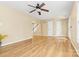 Open living room with hardwood floors, staircase, and ceiling fan at 5025 Gibraltar Dr, Sherrills Ford, NC 28673