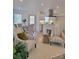 Bright living room features an open floor plan, connecting to the kitchen and dining area at 7493 Water Haven Trl, Denver, NC 28037