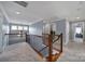 Upstairs hallway with neutral carpeting and laundry closet at 8908 Red Barone Pl, Waxhaw, NC 28173