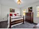 Bright bedroom with wood furniture and ample natural light at 910 Tait St, Lincolnton, NC 28092