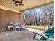 Covered patio with seating area, overlooking the backyard at 910 Tait St, Lincolnton, NC 28092