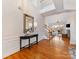 Bright entryway with hardwood floors, staircase, and console table at 15211 Arleta Cir, Charlotte, NC 28277