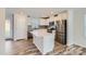 Modern kitchen with island, stainless steel appliances, and white cabinets at 1604 Cannonball Ln, Bessemer City, NC 28016