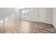 Bright living room featuring hardwood floors and a large window with blinds at 1604 Cannonball Ln, Bessemer City, NC 28016