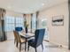 Bright dining room with table and chairs, near patio access at 1812 Otter Perch Ln, Fort Mill, SC 29715