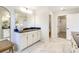 Modern bathroom boasts a spacious vanity with dark countertop and white cabinets at 2113 Bayou Trace Dr, Charlotte, NC 28262