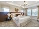 Main bedroom with a plush bed and large windows at 2113 Bayou Trace Dr # Lot 12, Charlotte, NC 28262