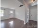 Bright living room featuring hardwood floors and large windows at 2274 Nc 109 S Hwy, Wadesboro, NC 28170