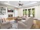 Living room with hardwood floors, fireplace, and built-in shelving at 4120 Cornwallis Camp Dr, Charlotte, NC 28226