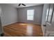 Light and airy bedroom with hardwood floors and a ceiling fan at 433 Pamela St, Gastonia, NC 28054