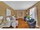 Living room with hardwood floors and neutral colored furniture at 7914 Rainbow Dr, Charlotte, NC 28227