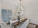 Bright dining room with a wooden table and neutral decor at 820 Millbrook Rd, Charlotte, NC 28211