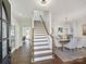 Bright entryway with hardwood floors and staircase at 820 Millbrook Rd, Charlotte, NC 28211