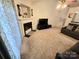 Comfortable living room featuring a fireplace and built-in shelving at 8325 Fox Swamp Rd, Charlotte, NC 28215