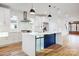 Modern kitchen with white shaker cabinets and a large island at 901 Edgemont Ave, Belmont, NC 28012