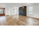 Spacious living room featuring hardwood floors and a contemporary fireplace at 901 Edgemont Ave, Belmont, NC 28012