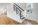 Modern staircase with dark wood treads and black metal railing at 901 Edgemont Ave, Belmont, NC 28012