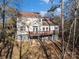 Two-story house exterior with deck and surrounding trees at 9066 Tulagi Ct, Tega Cay, SC 29708