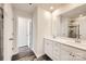 Primary bathroom with double vanity and large mirror at 9823 Old Garden Cir, Gastonia, NC 28056