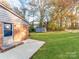 Landscaped backyard with shed and brick patio at 1006 Wooddale Ct, Dallas, NC 28034