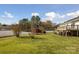 Large backyard with green grass and white fence at 104 Vista Dr, Davidson, NC 28036