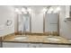 Double vanity bathroom with granite countertop and large mirrors at 104 Vista Dr, Davidson, NC 28036