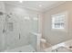 Modern bathroom with a large walk-in shower and marble tile at 104 Vista Dr, Davidson, NC 28036