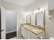 Double vanity bathroom with granite countertop and access to another room at 104 Vista Dr, Davidson, NC 28036