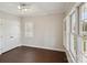 Bright bedroom with wood floors, double doors, and plantation shutters at 104 Vista Dr, Davidson, NC 28036