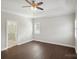 Spacious bedroom with hardwood floors, ceiling fan, and ensuite bathroom access at 104 Vista Dr, Davidson, NC 28036