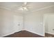 Well-lit bedroom with double doors and hardwood flooring at 104 Vista Dr, Davidson, NC 28036