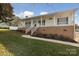 Two-story home with a large front porch and yard at 104 Vista Dr, Davidson, NC 28036
