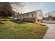 Ranch style home with front porch and landscaped yard at 104 Vista Dr, Davidson, NC 28036