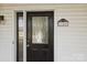 Black front door with glass panels and house number plaque at 104 Vista Dr, Davidson, NC 28036