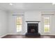 Cozy living room featuring a fireplace and built-in shelving at 104 Vista Dr, Davidson, NC 28036