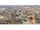 Wide aerial shot of suburban neighborhood with tree-lined streets and houses at 11236 Mallard Crossing Dr, Charlotte, NC 28262