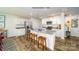 Modern kitchen with white cabinets, granite countertops, and island at 12208 Lady Bell Dr, Charlotte, NC 28278