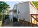 Neat side yard with steps leading to a patio and deck at 1228 Matheson Ave, Charlotte, NC 28205