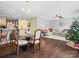 Dining area with hardwood floors and a view of the living room at 13210 Reunion St, Charlotte, NC 28278