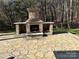 Stone fireplace and patio area perfect for outdoor entertaining at 1327 Moonshadow Ln, Shelby, NC 28150