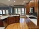 Open kitchen with island, wood cabinets and stainless steel appliances at 1327 Moonshadow Ln, Shelby, NC 28150
