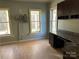 Bright home office with built-in cabinets and hardwood floors at 1327 Moonshadow Ln, Shelby, NC 28150