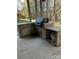 Granite-topped outdoor kitchen with stainless steel appliances and gas grill at 1327 Moonshadow Ln, Shelby, NC 28150